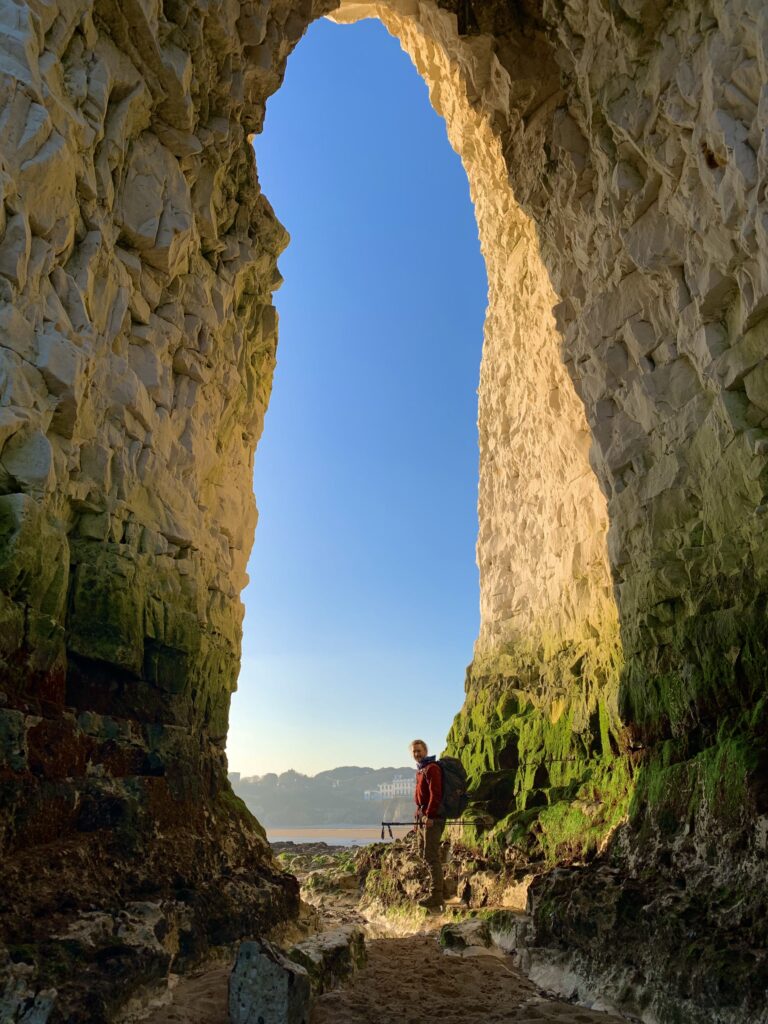 Standing in the sea arch of Kingsgate Bay, Kent, England